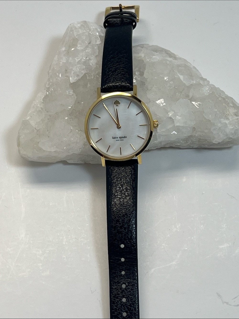 Kate Spade gold tone Watch. Black leather strap.